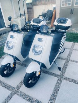 Pair Of Zebra electric/Bike  Scooters.