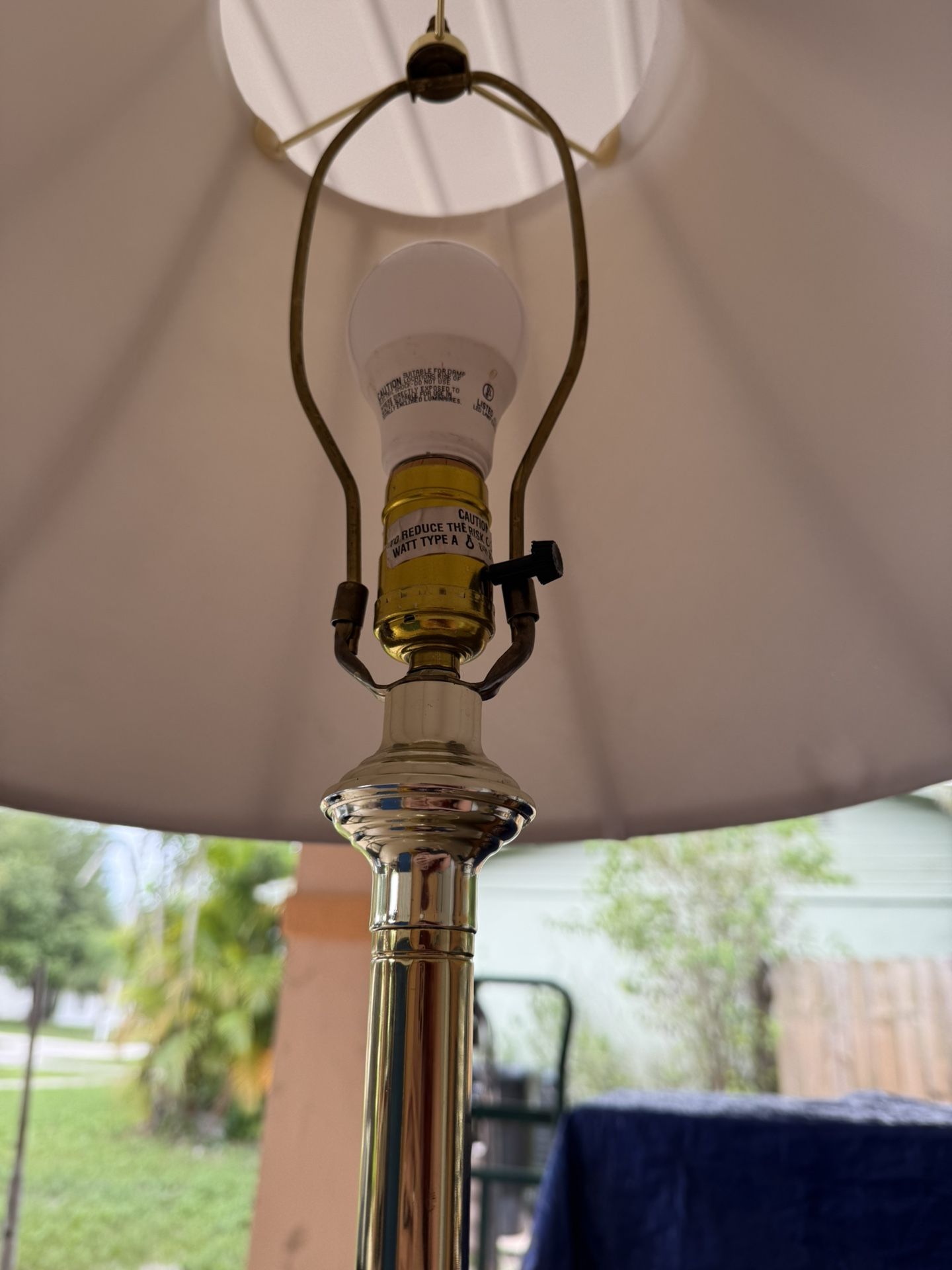 brass floor lamp with glass table