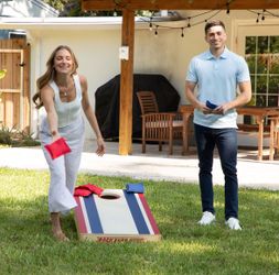 Backyard hero official size cornhole set missing the red and green tossing bags