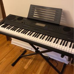 Keyboard with stand and headphones