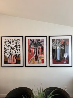 Floral prints in black frame