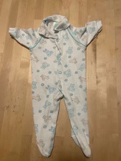 Cream Footed Baby One-Piece with Pastel Blue Trim and Animal Print
