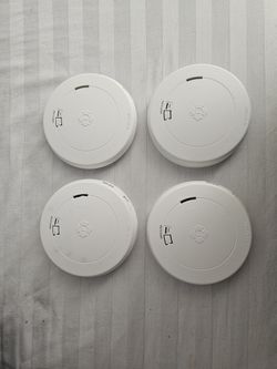 4 First Alert Smoke Detectors.