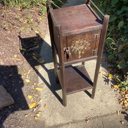 Humidor from 1920s all wood  inside the box has shelf fine antique sturdy solid the stencil or art work is fading because of age 9x9-27 Tall low profi