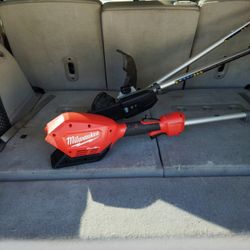 Milwaukee mower combined with a chainsaw