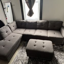 grey two piece sectional with ottoman 