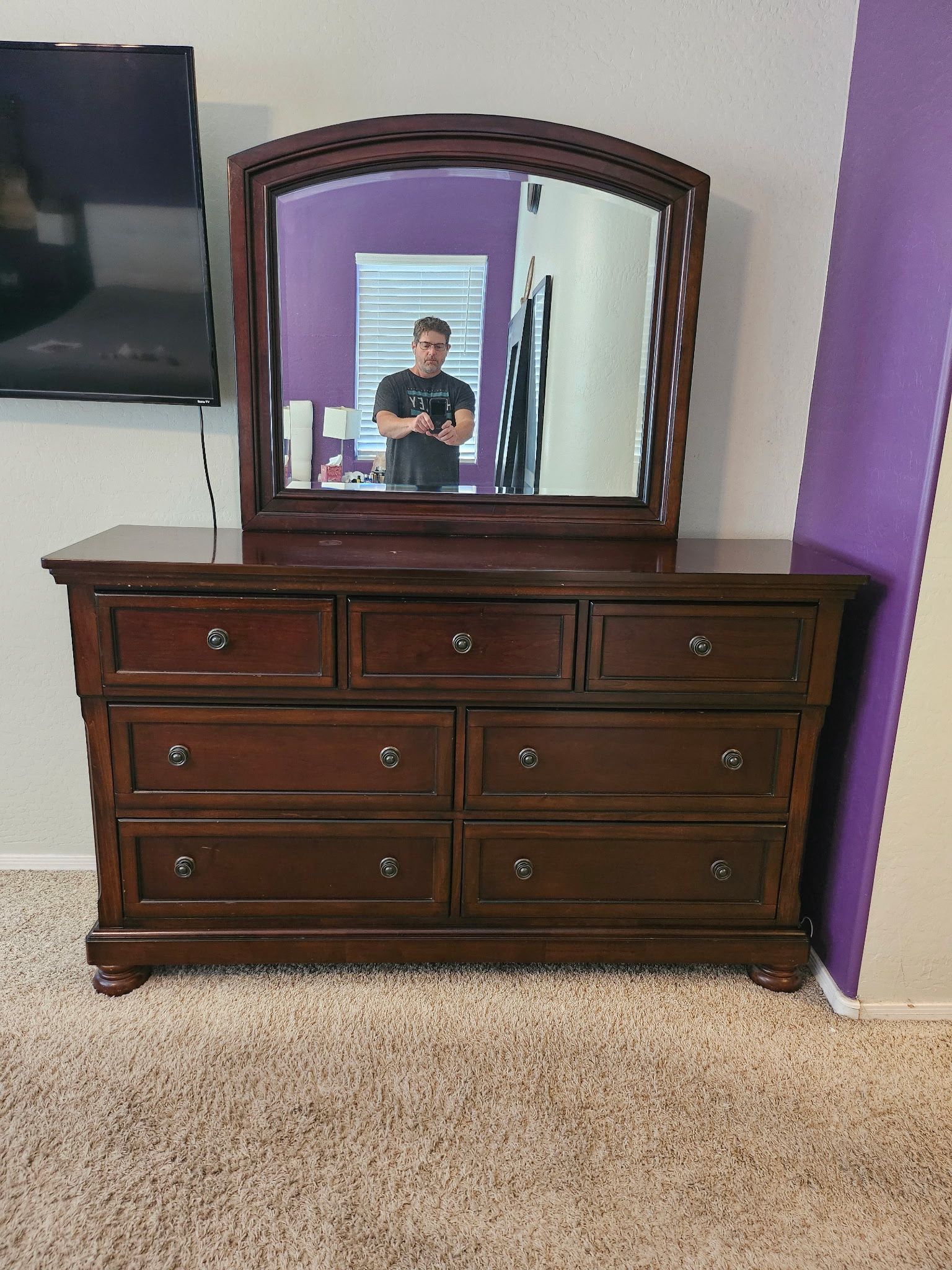 Ashley Porter 7 Drawer Dresser & Mirror. Asking $500 obo. Details and dimensions in photos. Set of two matching nightstands available also.