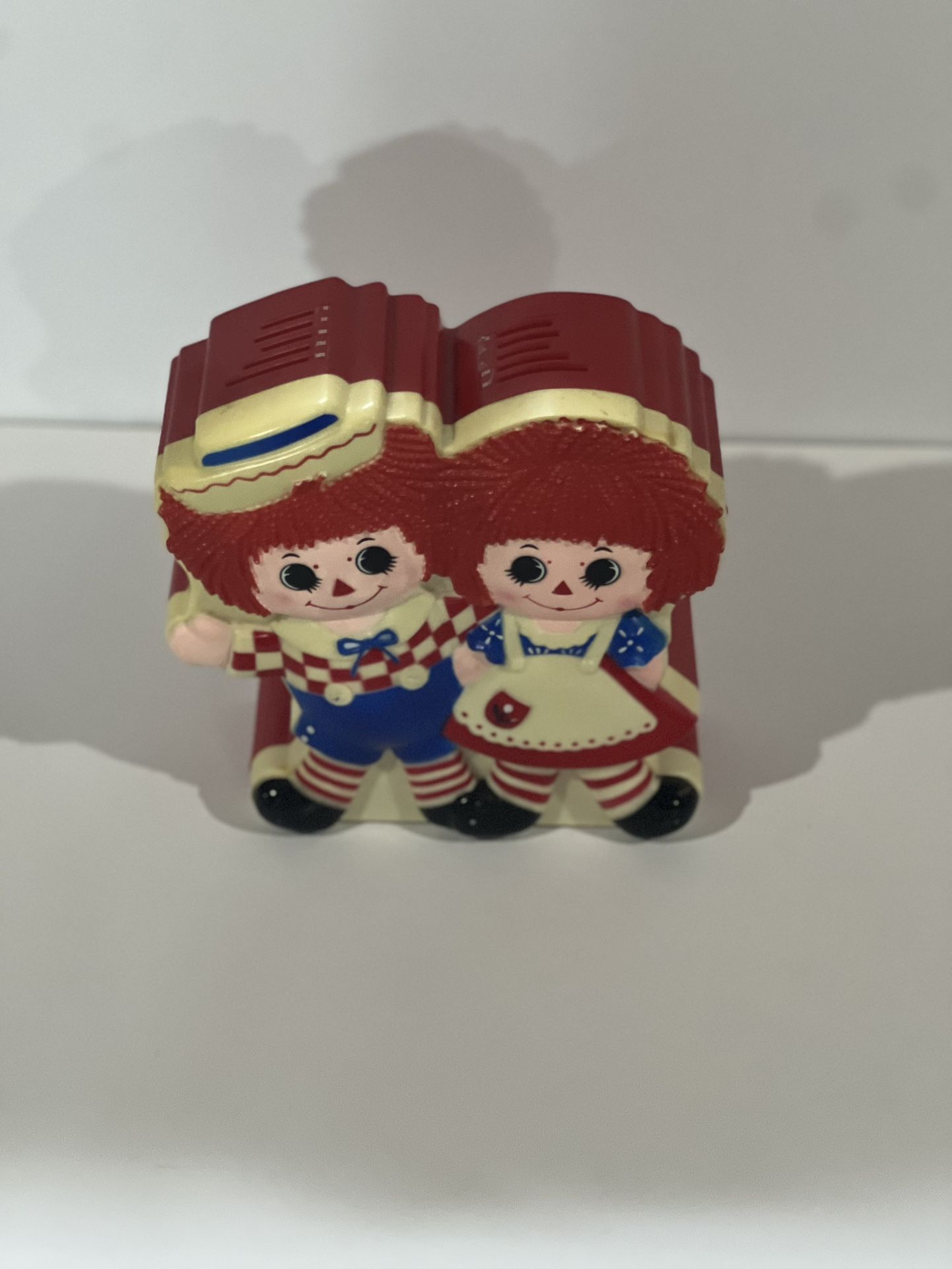 Vintage 1977 Raggedy Ann and Andy Talking Coin bank.