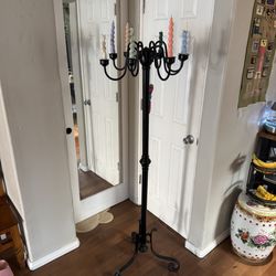 Antique floor candelabra with rainbow candles