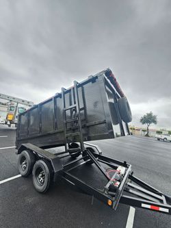 NEW DUMP TRAILER 12X8X4 12000 LBS
ROLLING TARP--SPARE TIRE,ELECTRIC BRAKES,HYDRAULIC SYSTEM,REMOTE CONTROL,IDEAL FOR HAULING, DEMOLITION, TRASH ETC,