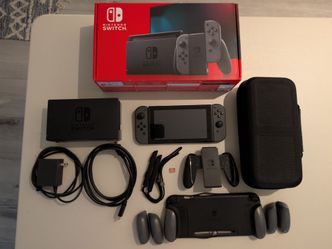 Nintendo Switch with Gray Joy-Con Controllers, 128GB SD card, grip case, carrying case, screen protector, dock