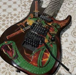 Electric Guitar with High Quality, Skull Snake Pattern, Double-Coil Tremolo, 24-Fret Rosewood Fretboard, Black Hardwar Brand New still in the box E534