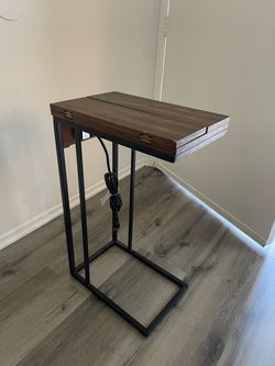 Side table with outlet