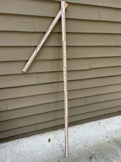 Leveling rod for grade elevation