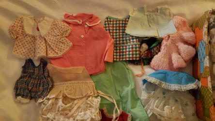 Box of vintage doll clothes, hats, shoes