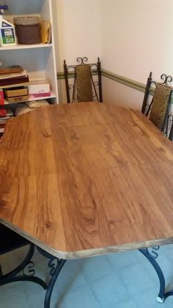 Table with iron legs and 2 leafs plus 6 chairs