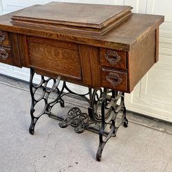 Antique Bruce Treadle Sewing Machine In Oak Cabinet, Cast Iron Base.