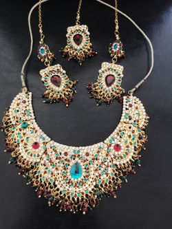 Heavy Kundan choker necklace set with earrings and mung tikka.