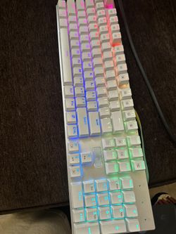 Multicolor white keyboard with different color patterns ,white mouse multi colored as well and an additional 20 blue switches and exotic pc mouse pad