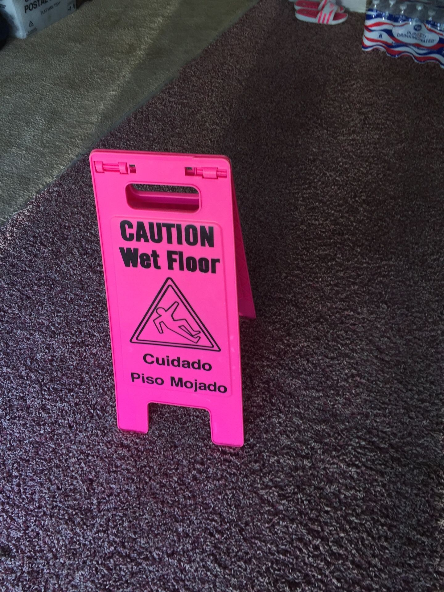 Pink floor sign Caution Wet Floor