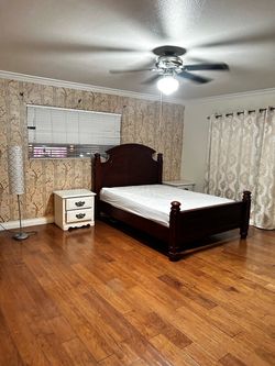 Dark Cherry Wood Four-Post Bed Frame