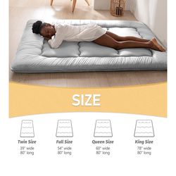 Futon mattress (queen sized) with cotton cover.