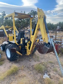 Yellow Mini Backhoe Loader