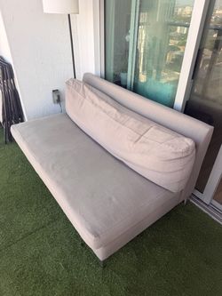 Grey Armless Sofa with Bolster Pillow