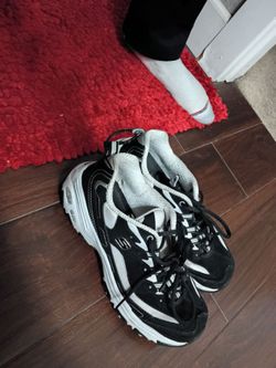 Black and white Sketcher tennis shoes