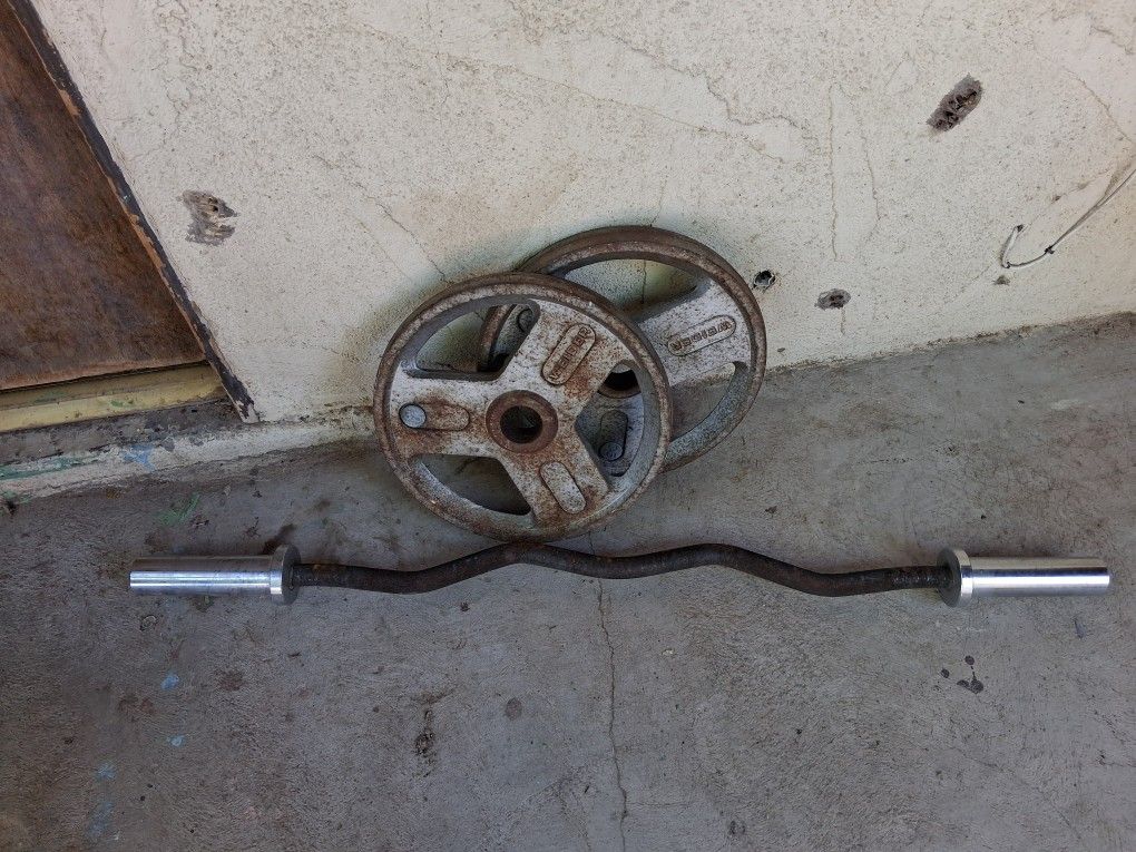 $100 WEIDER 35 LBS PLATES AND CURL BAR