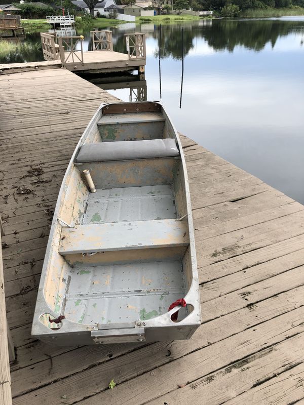 12 foot Jon boat includes two marine batteries and battery charger and