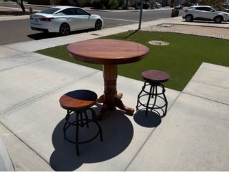 Round table with 2 swivel barstools