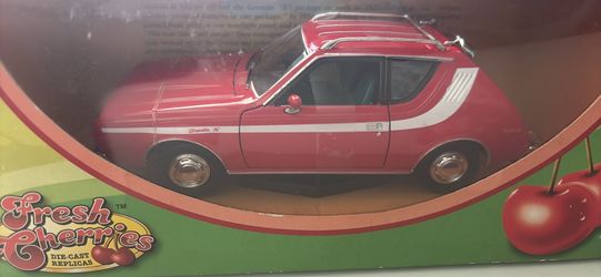Fresh cherries die cast red car