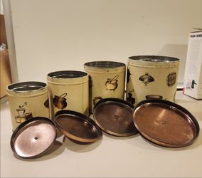 Vintage 4-piece nesting kitchen canister set with matching copper-tone metal lids