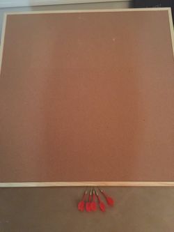 Cork board with darts