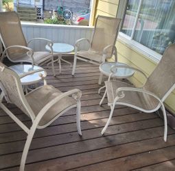 Four Chairs And Three Tables