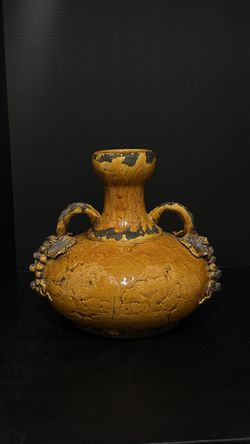 Orange glazed footed pottery