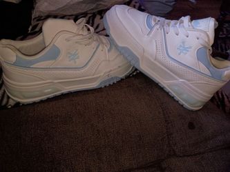 White and light blue athletic New Yonkers tennis shoes