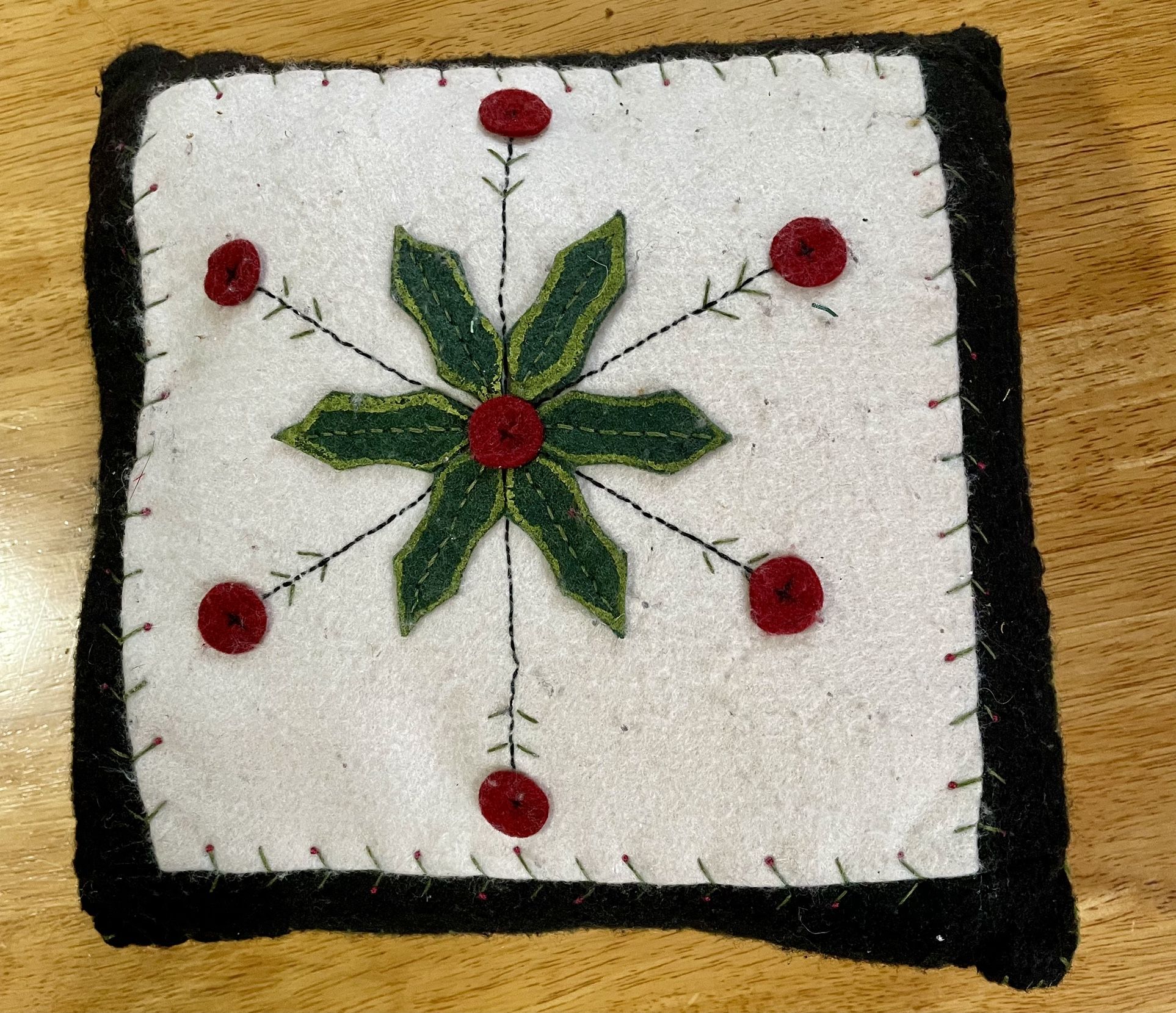9.5” Holiday folk art pillow, appliqued flowers , wool