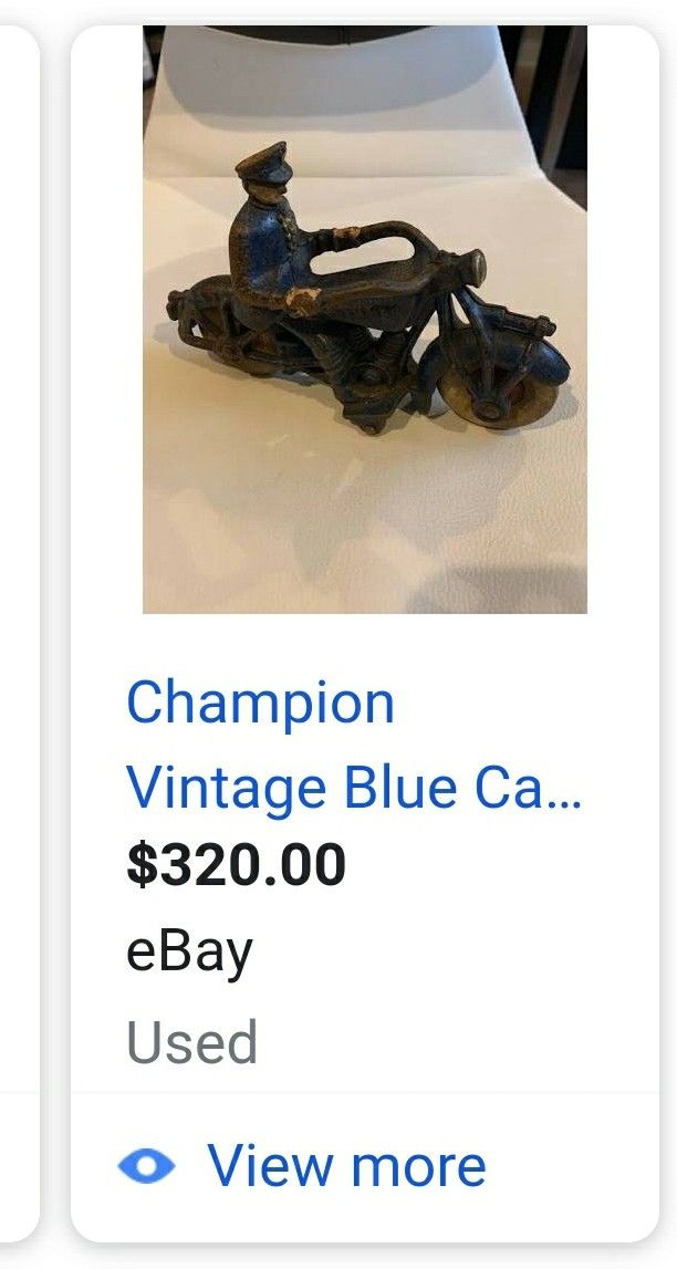 Champion Vintage Blue cast iron toy motorcycle.