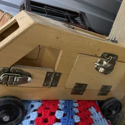 Toy Truck With Several Different Open And Close Latches To Teach Children 