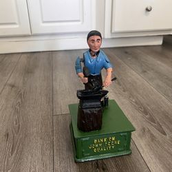 Vintage Bank on John Deere Quality cast iron mechanical blacksmith w/ anvil coin bank Great Working Condition 