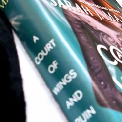 A Court of Wings and Ruin* by Sarah J. Maas features a striking cover designed 