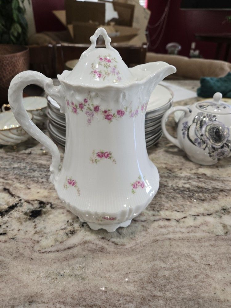 Antique tea cups and pitchers