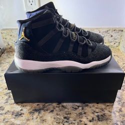 Air Jordan 11 Black Gold Stingray Sneakers