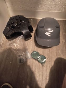 New baseball helmet slightly used taekwondo headgear and one brand new pair of hand wraps and four brand new mouthpieces