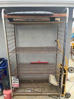 Heavy duty rolling storage rack with adjustable and removable shelves