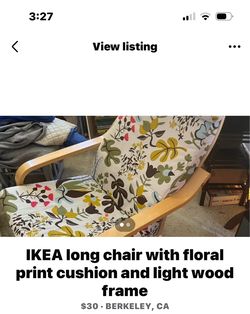 IKEA long chair with floral print cushion and light wood frame