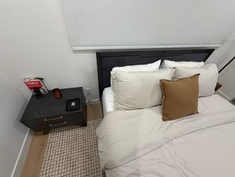 Queen size bed with one nightstand