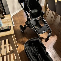 Evenflo double stroller with two seats and car seat insert with car seat base